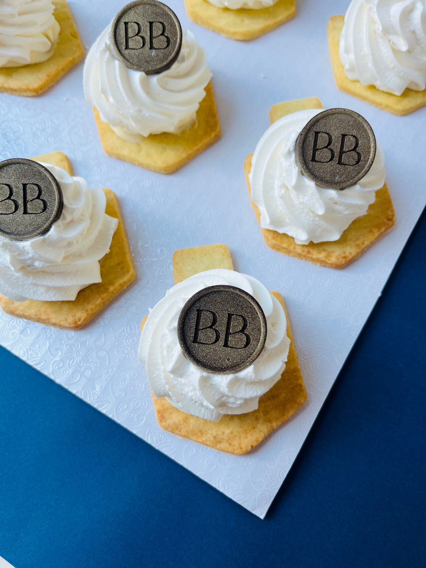 Dreidel Custard and Cream Cookies with Signature Berel’s Bakes Coin